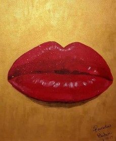 Brilliant red lips on a background of gold.